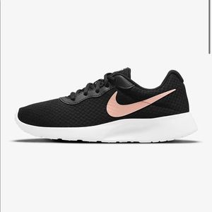 Black and rose gold Nike running shoes